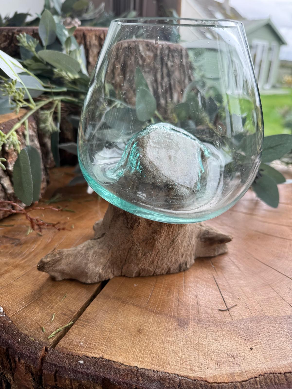 HANDBLOWN GLASS BOWLS SET ONTO A WOODEN DISPLAY